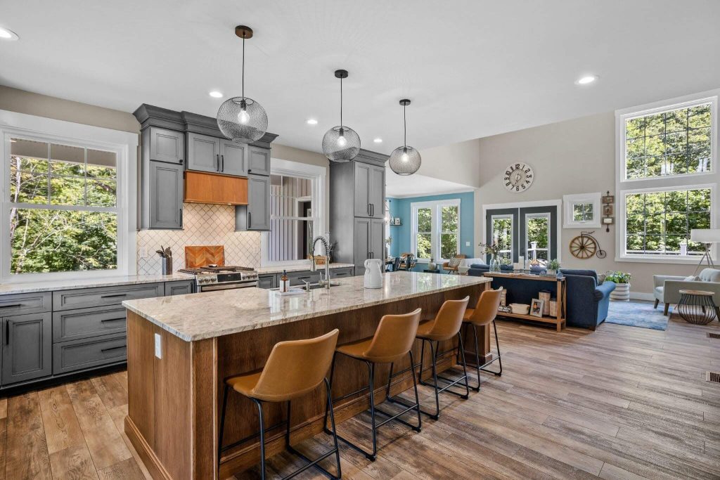 Interior design of a kitchen with a large island in a modern New England colonial home